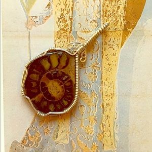 Silver wrapped fossil pendant